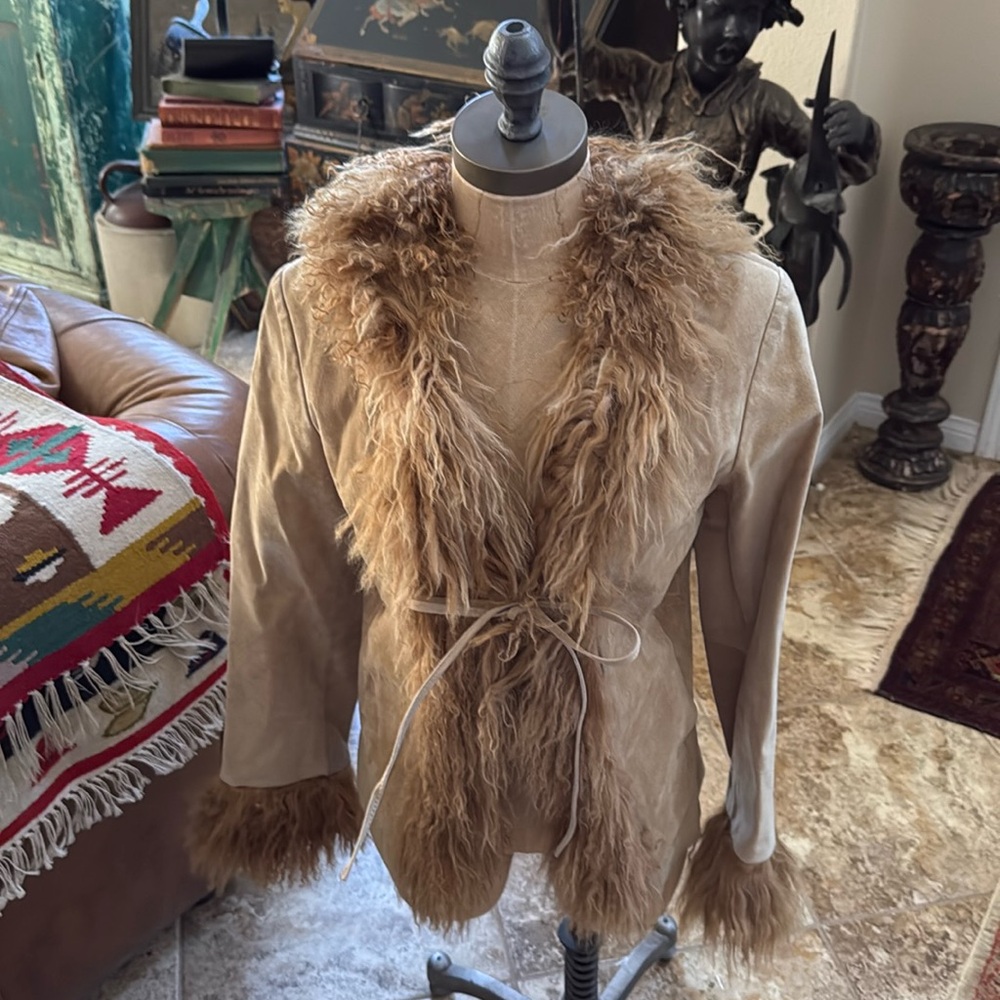 Selling a xs suede and Mongolian lamb front tie ladies jacket w pickets fitted